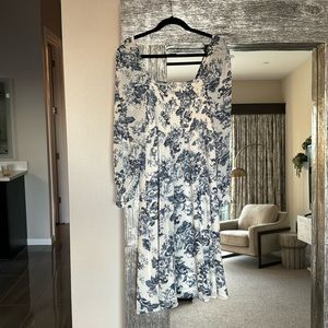 Darling navy floral dress by OPT in size L. Knee length with 15” slit on left